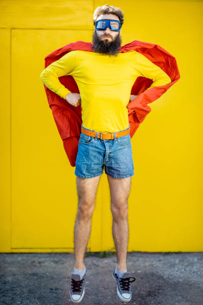 istock Superman portrait on the yellow background 1169599029