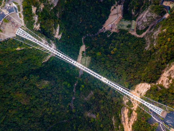 Arial Top View of Zhangjiajie Grand Canyon and Glass Bridge on sky, China Arial View of Zhangjiajie hunan province photos stock pictures, royalty-free photos & images
