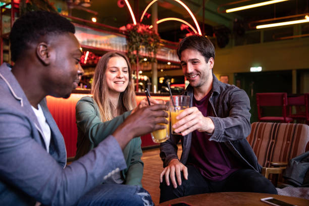 istock Nightlife in a London Pub, friends spending some great time together 1169602000