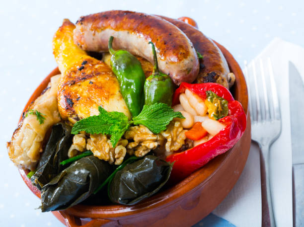 istock Kapama with grilled sausage, grape rolls, stuffed pepper and fried chicken 1169609064