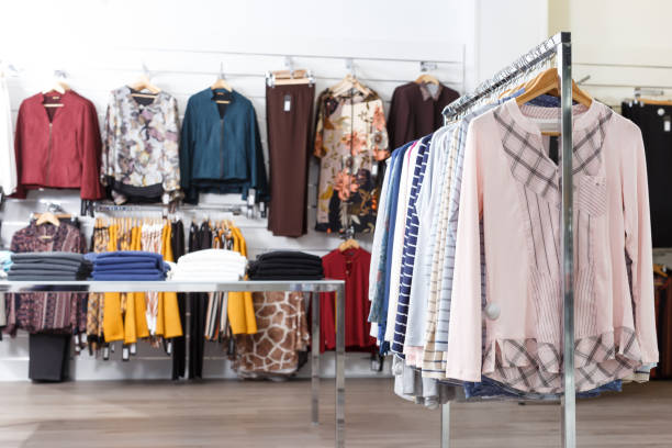istock Many elegant clothes on hangers and shelfs 1169609782