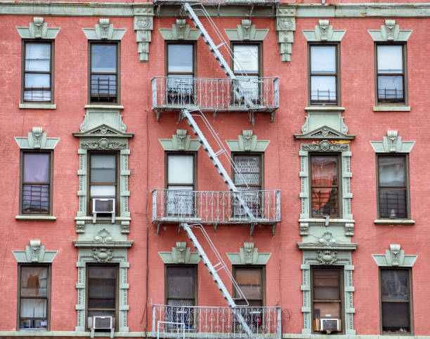 istock Red brick facade, and fire stairs. Harlem, NYC. 1169611074