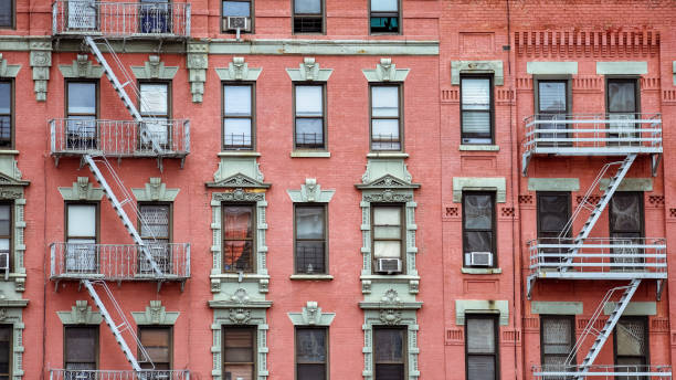 istock Red brick facade, and fire stairs. Harlem, NYC. 1169611148