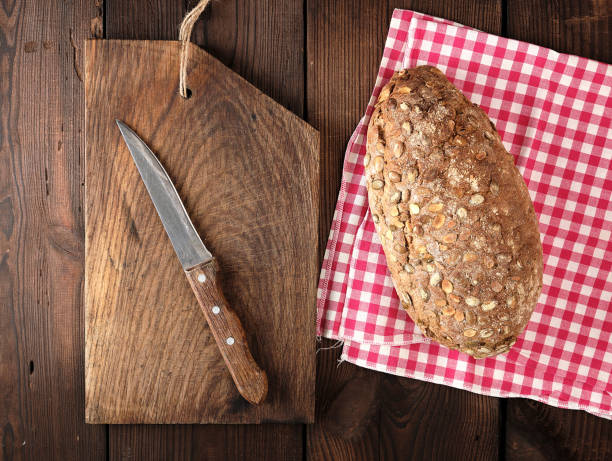 istock oval bread made from rye flour with pumpkin seeds on a red napkin 1169611912