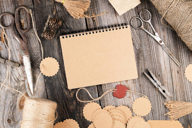 istock notepad with brown empty sheets on a gray wooden table, next to it are a rope 1169612783