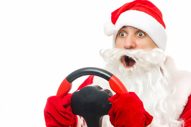 istock emotional Santa steering wheel on a white background 1169612825