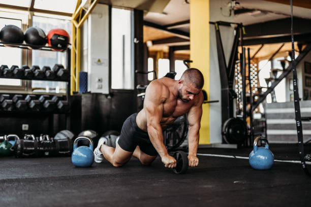 istock Exercising in the gym 1169614220