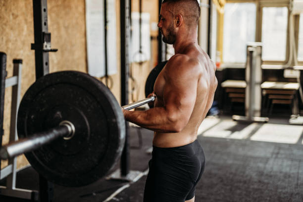 istock Exercising in the gym 1169614317