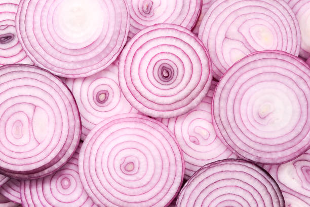 istock Onion slices as a background. Top view. 1169616835