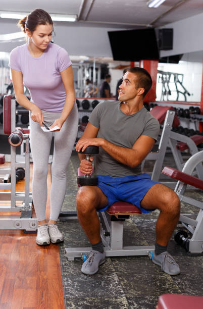 istock Man and girl capturing on paper training results 1169618170