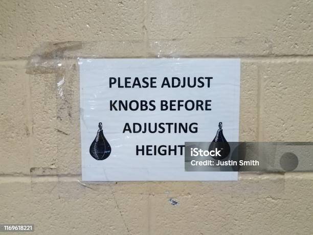 Please Adjust Sign Please Adjust Knobs Before Adjusting Height Sign With Boxing Bag On ...