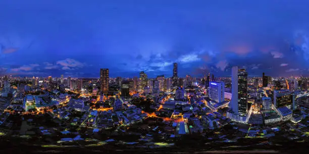 360 panorama by 180 degrees angle seamless panorama view of aerial view of Bangkok Downtown Skyline. Thailand. Financial district and business centers in urban city. Skyscraper buildings at night.