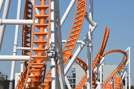 Low Angle View Of Rollercoaster Against Clear Blue Sky