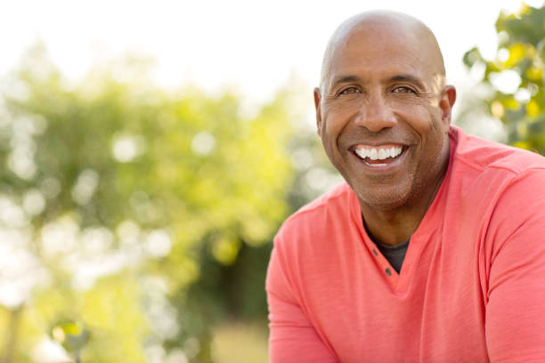 istock Mature handsome African American man smiling outside. 1169621879