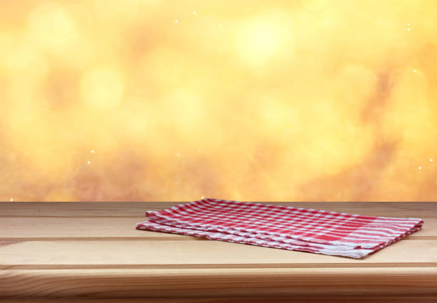 istock empty table with red towel on autumn blurred background. copy space. 1169623160