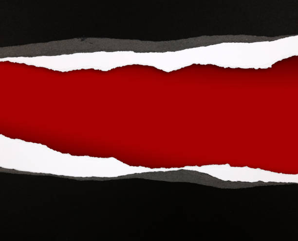 istock Ripped paper on red 1169630486
