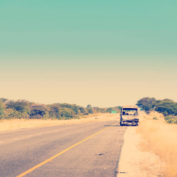 istock Burned Out Car in Africa 1169631682