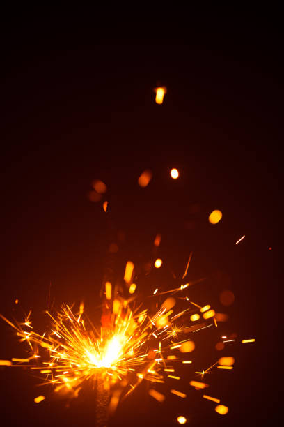 istock Christmas sparkler in haze with red light 1169633626