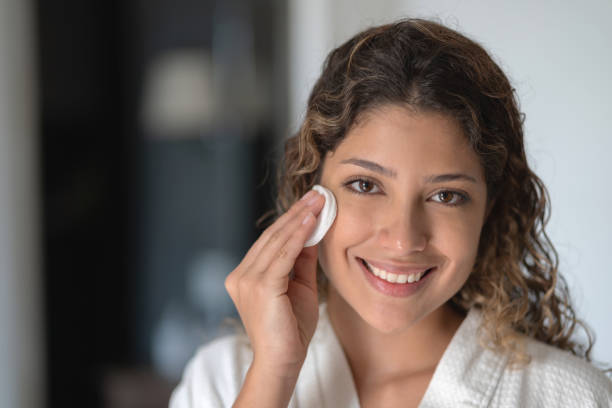 istock Woman removing her make-up with cotton pad 1169634773