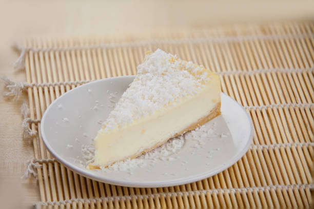 delicious cheesecake with coconut on  plate stock photo