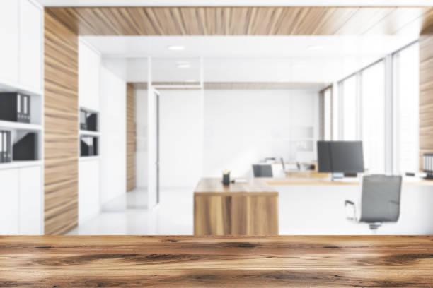 istock White and wood manager office with bookcase, blur 1169641149