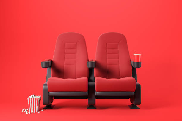 istock Two red cinema chairs on red 1169641745