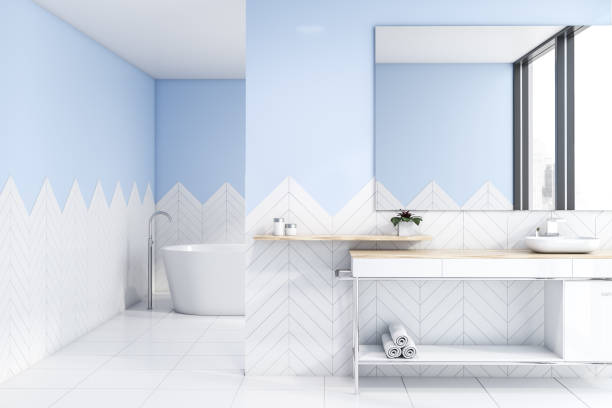 istock White and blue bathroom with sink and tub 1169642152