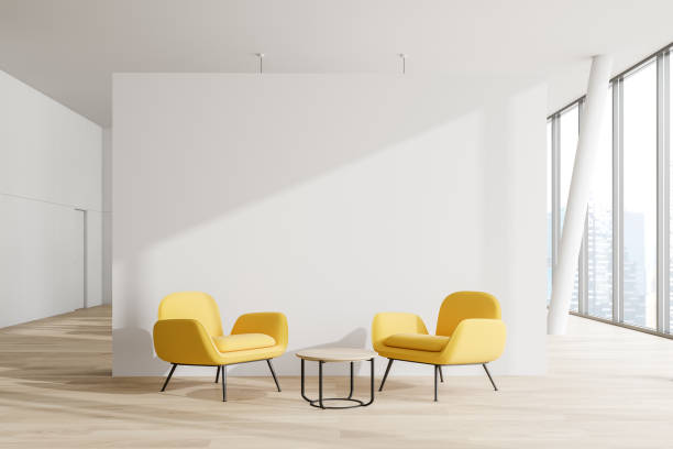 istock White office waiting room, yellow armchairs 1169642223