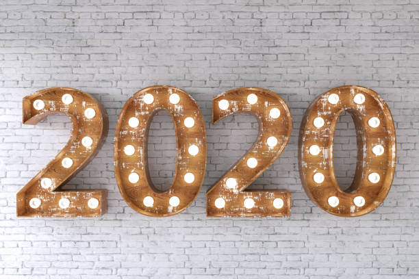 istock 2020 Light Bulb Sign on Brick Wall. New Year Concept 1169643173