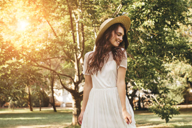 istock Happy girl walking through the summer park 1169644300