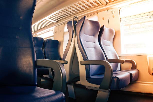 istock Interior of a passenger train with empty seats 1169645073