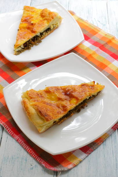 istock A piece of cake with liver and egg on a white plate. 1169645178