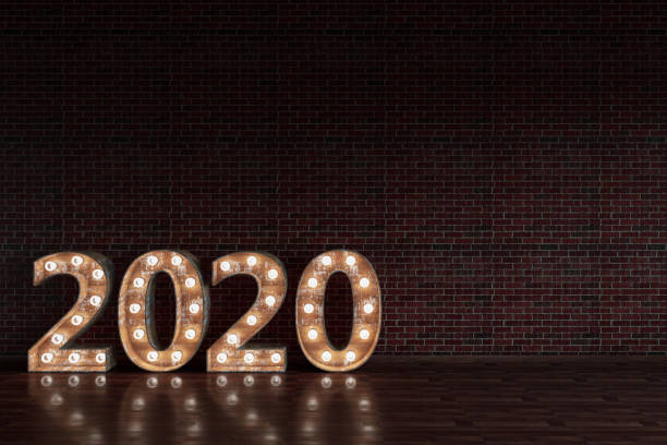 istock 2020 Bulb Sign On Black Brick Wall 1169647261