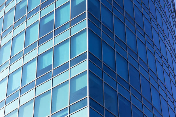 istock Glass surface of windows with reflection in district business centers. 1169648732