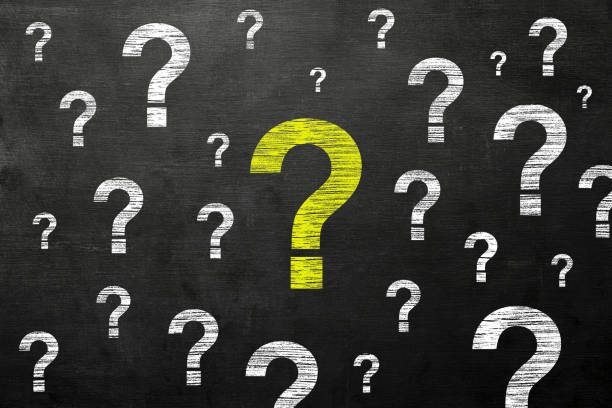 istock Yellow chalk question mark on the blackboard 1169649731
