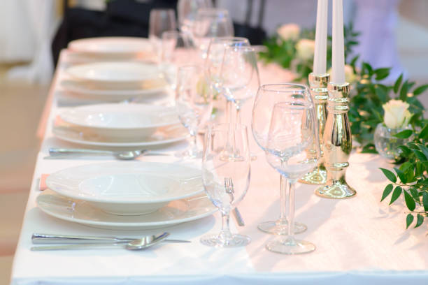 istock Wedding table place setting, plates and glasses 1169650709