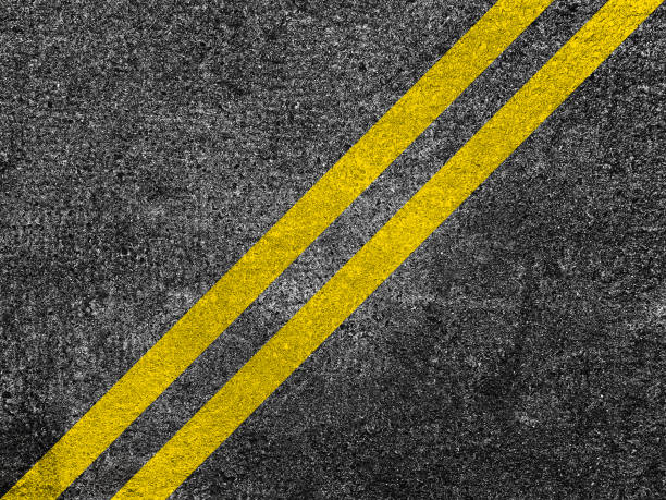 istock Asphalt road with double yellow lines 1169650925