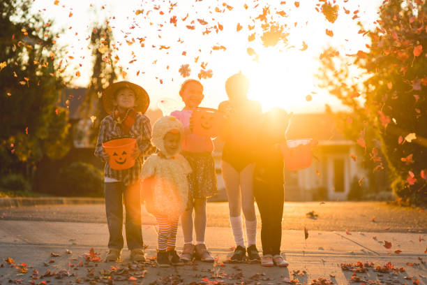 istock Multiethnic group of kids trick or treating 1169655353