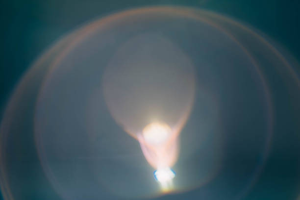 istock blur lens flare teal blue background bulb radiance 1169655390