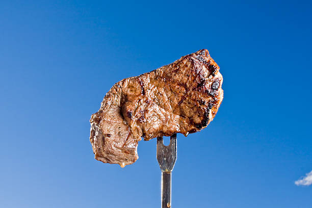 bife no garfo - broiling imagens e fotografias de stock