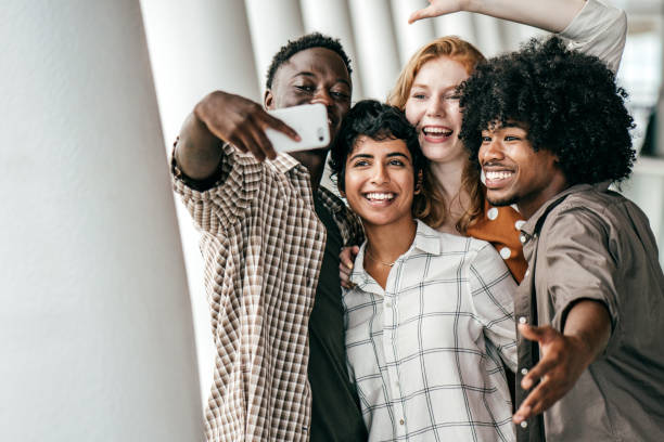 istock Group of students posing for photos 1169656090