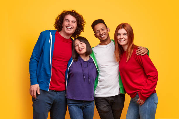 istock Multiethnic friends smiling while standing in embrace 1169656454