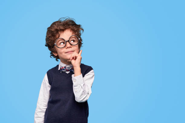 istock Thoughtful schoolboy looking away 1169656457