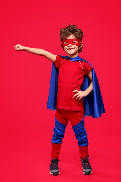 istock Cheerful superhero in heroic pose 1169656479
