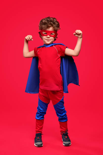 istock Little superhero showing muscles 1169656489