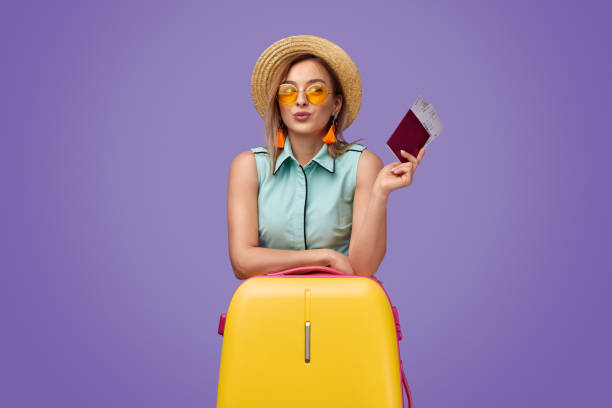 istock Stylish tourist leaning on suitcase 1169656511