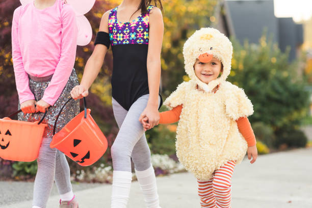istock Multiethnic group of kids trick or treating 1169657488