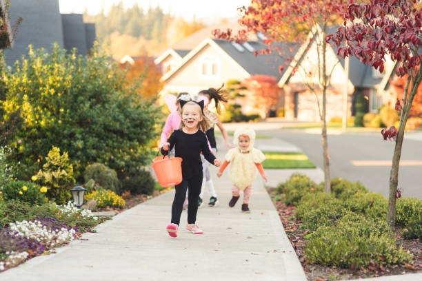 istock Multiethnic group of kids trick or treating 1169657507