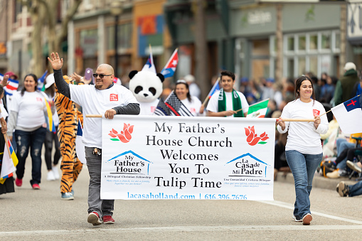 Holland, Michigan, USA - May 11, 2019: Tulip Time Parade, Latinos Promoting My Father's House, Christian Church during the parade