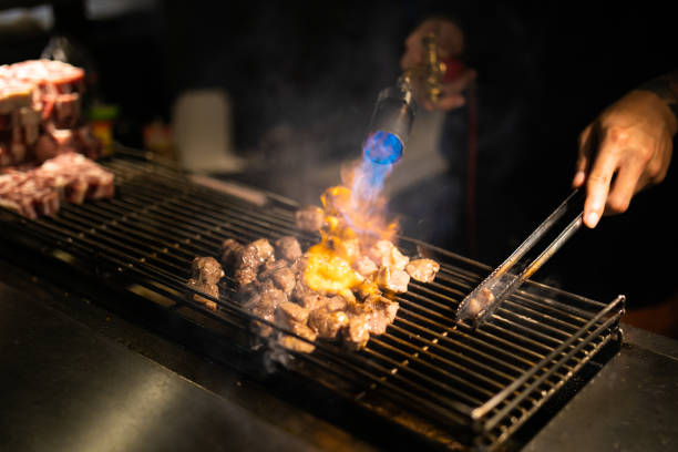 istock Night market meat BBQ'ing 1169663928